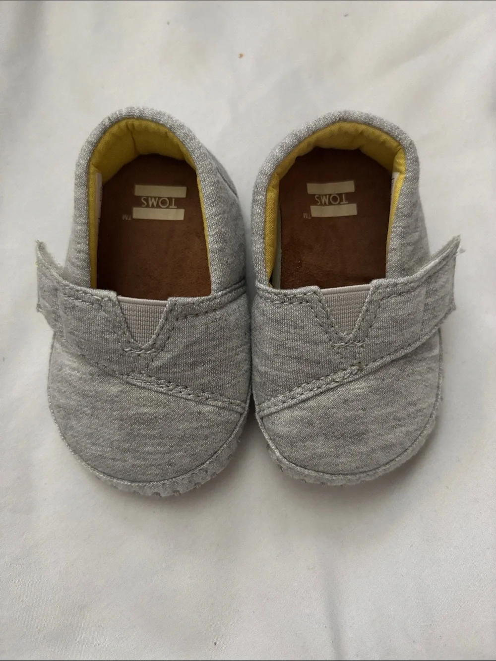 Toms Baby Gray Slip-On Shoes with Yellow Lining
